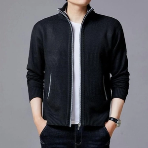 Close-up of black men's knit cardigan featuring a silver-grey zipper and ribbed stand collar