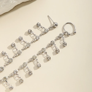 Silver punk style stud and ear cuff set featuring hanging rhinestone tassel chains