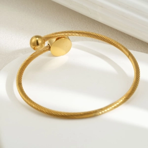 Minimalist golden stainless steel twisted open bangle bracelet with ball and disc ends