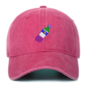Detailed close-up of colorful beverage bottle embroidery on vintage wash baseball cap