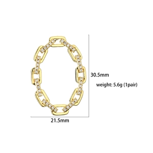 Detailed view of 18K gold plated U-shaped link earrings with micro-set zircon stones