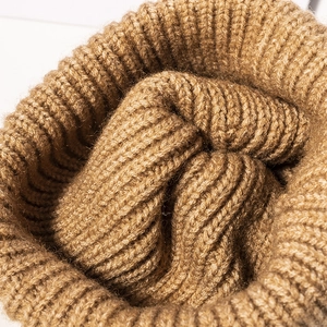 Classic brown chunky knit beanie hat with thick warm texture and high cuff detail
