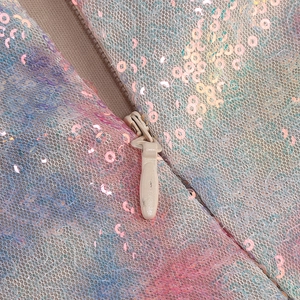 Close-up of multicolor gradient sequins and high-quality beige invisible zipper detail