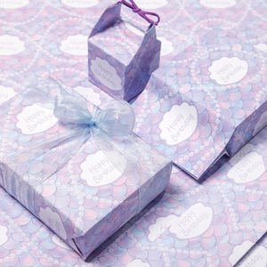 Pastel gradient gift wrap set with fish scale pattern and Happy Birthday ribbons