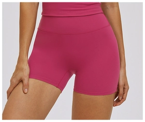 Close-up of high-waist rose pink yoga shorts showing seamless compression and stretch fabric
