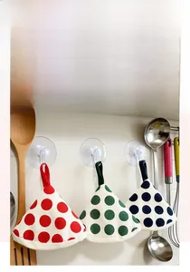 Polka dot fabric potholders in cone shape with hanging loops for kitchen heat protection