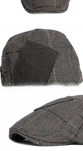 Detail view of grey herringbone wool flat cap featuring a retro square side patch