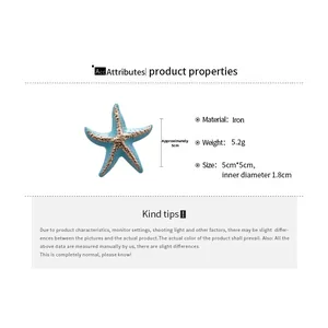 Detailed view of sky blue starfish ring with gold accents showing 5cm dimensions and specs