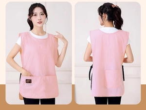 Pink waterproof apron vest with four pockets and adjustable straps for coffee shop work