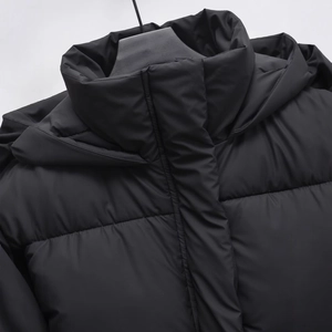 Women's black hooded puffer jacket with warm padded insulation and quilted windproof design