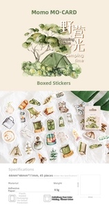 Macro shot of camping themed stickers with tents and campfires for DIY journals