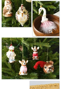 Detailed view of painted glass animal ornaments including owl and swan for Christmas trees