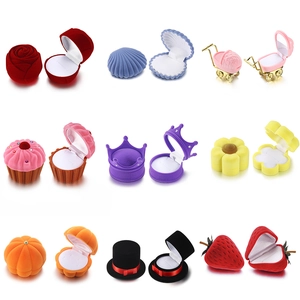 Creative velvet ring boxes in various shapes like rose, shell, and strawberry