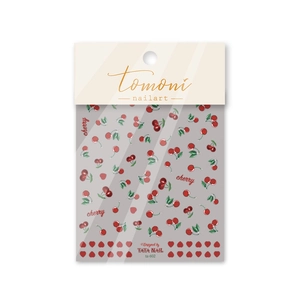 Dettaglio degli adesivi per nail art con ciliegie rosse a rilievo e design a cuore Tomoni