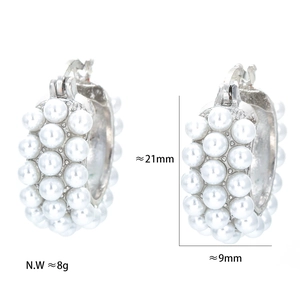 Detail view of pearl hoop earrings showing 21mm height and 9mm width dimensions