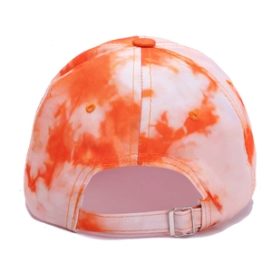 Detail view of the silver metal adjustment buckle on the silk tie-dye baseball cap