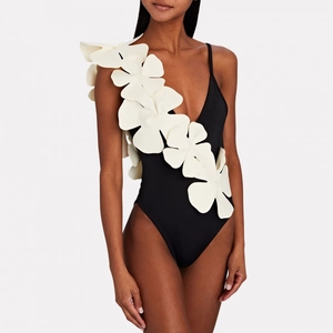 Women's V-neck one-piece swimsuit with 3D white floral accents and open-back skirt design