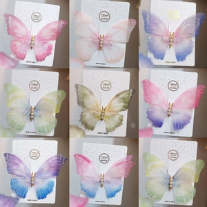 Detailed collection of gradient mesh butterfly hair clips with pearl and gold accents