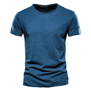 Detail showing deep blue slub cotton fabric texture and V-neckline of a men's t-shirt