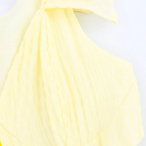 Pale yellow textured dress with flutter sleeves and honeycomb fabric detail