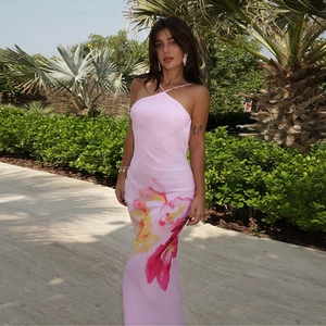 Pink halter neck maxi dress with large floral prints in a slim fit backless silhouette