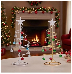 Close-up of golden and silver metal wire Christmas trees with colorful bell ornaments