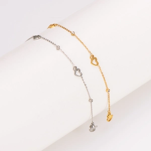 Stainless steel hollow heart anklet with diamonds in gold and silver finishes