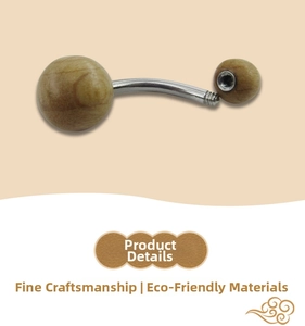 Detail of wooden belly button ring showing internal thread and natural wood grain finish
