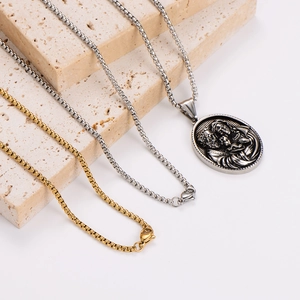 Vintage relief family pendant necklaces in gold and silver on stone blocks