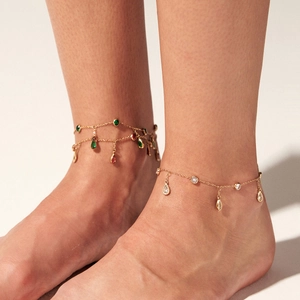 Elegant gold-plated stainless steel anklets featuring colorful zircon tassels on a model