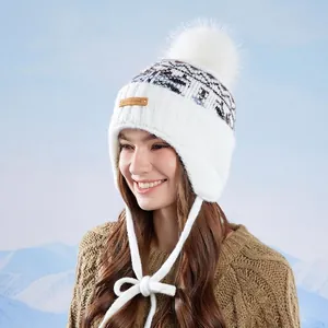 Winter knit trapper hat for women with pompom and earflaps, outdoor thermal headwear