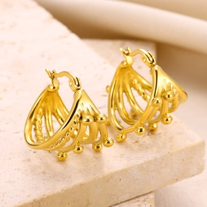Macro shot of 18K gold-plated geometric hollow earrings with vintage layered line details
