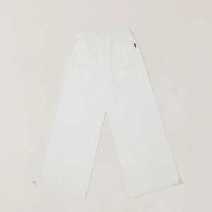 Detail of the elastic waistband and back pocket stitching on white cargo pants