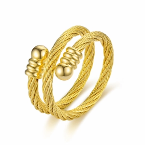 Detailed view of golden titanium steel woven ring featuring sphere and loop ornaments