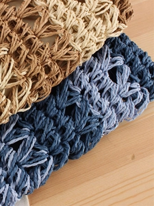 Handwoven straw crossbody bags in gradient colors and natural textures for beach vacations