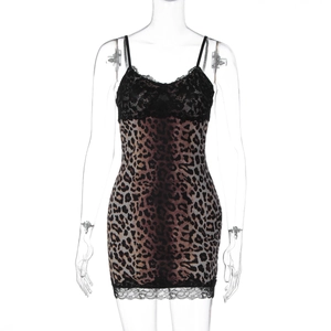 Detail of leopard print dress featuring black lace trim and fine shoulder straps