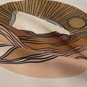 Detail showing the heavy fabric texture and earthy boho sun patterns on the tapestry