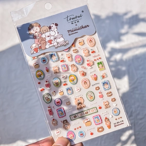 Detail of MC-24 embossed 3D nail stickers featuring cute brown bears and cupcakes
