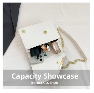Detailed capacity display showing phone and cosmetics inside white chain crossbody bag