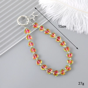 Detail of 15cm heart crystal beaded phone strap with silver balloon dog charm