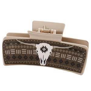 Beige hair claw clip with western style bull skull pattern and geometric design