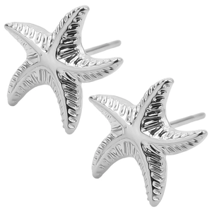 Macro view of silver starfish stud earrings showing detailed sea life textures and finish