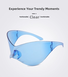 Detail view of blue one-piece wraparound sunglasses with a futuristic Y2K style design