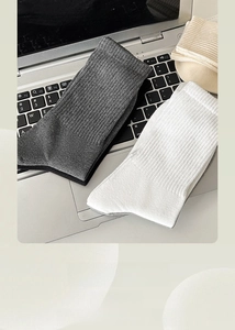 Detailed view of the fine ribbed knit texture of premium cotton crew socks