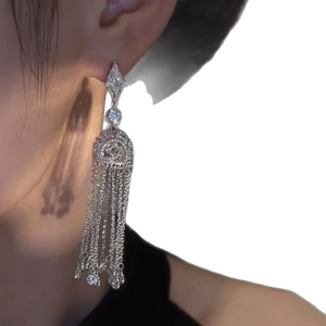 Silver diamond geometric rhombus lantern tassel earrings worn by female model