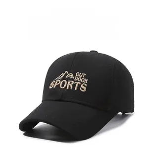 Close-up of embroidered outdoor sports lettering and mountain logo on black baseball cap