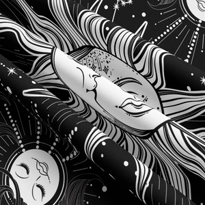 Detail of bohemian sun and moon celestial tapestry with textured black and white fabric