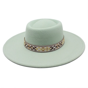 Close-up of mint green wool felt hat with vintage ethnic woven geometric patterned band