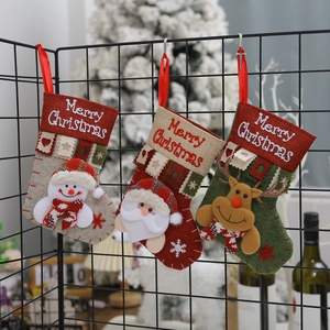 Christmas stockings set with 3D Santa, Snowman and Reindeer dolls on a mesh rack