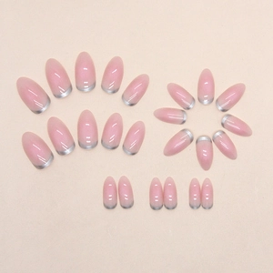 Pink almond press-on nails with silver French tips displayed in a neat set layout
